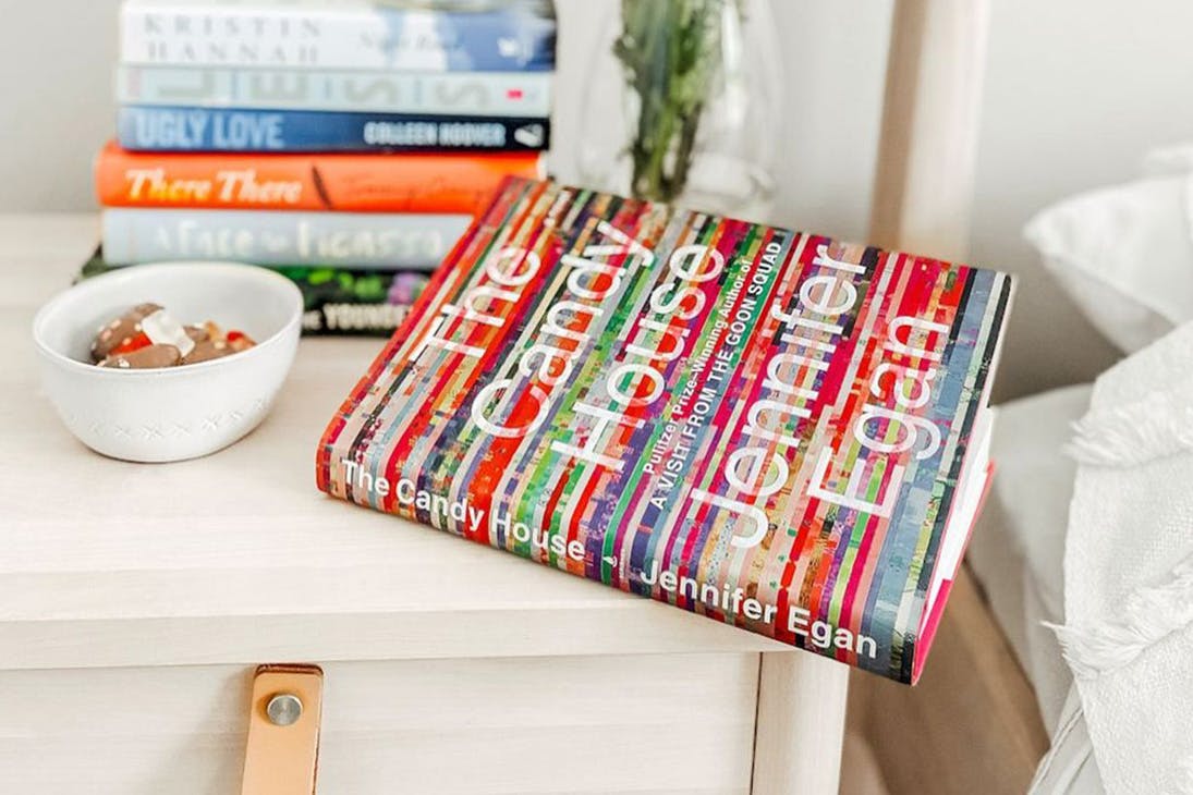 a book sitting on a bedside table
